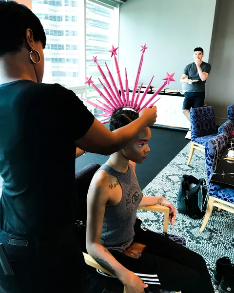 Existing studio portfolio image of hair styling during a creative production