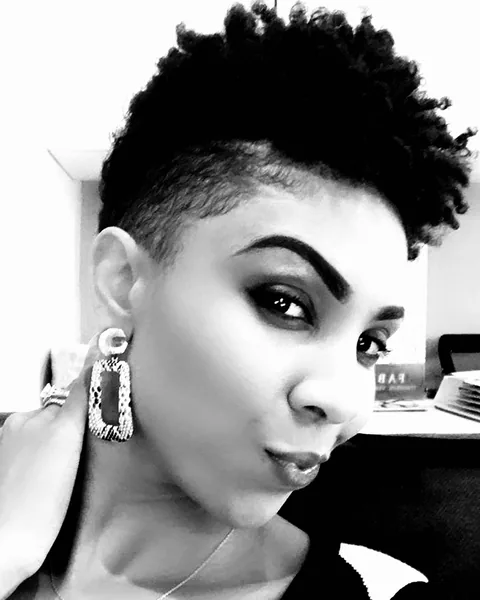 Monochrome portrait with a tall textured cropped hairstyle